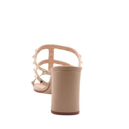 beige block heel sandal with gold studs on the straps back view 