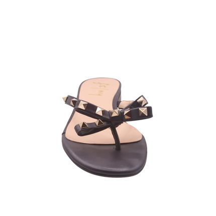Navy thong sandal with two bow-shaped straps decorated with gold pyramid studs front view 