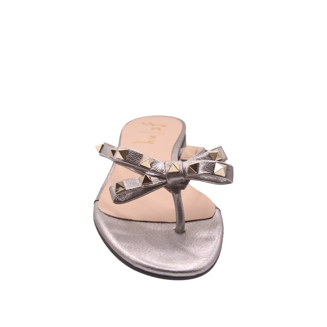 Pewter thong sandal with two bow-shaped straps decorated with gold pyramid studs front view 