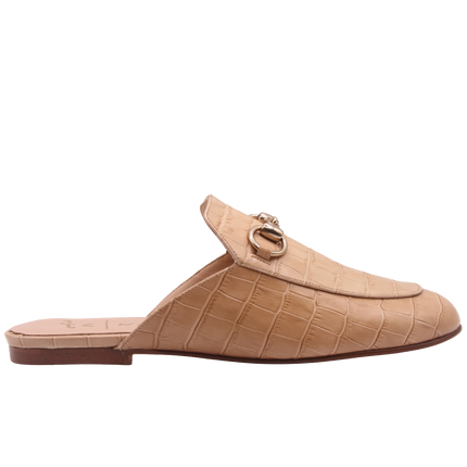 Taupe crocodile-embossed leather mule with a pointed toe, low heel, and a gold buckle detail on the top. Side view 