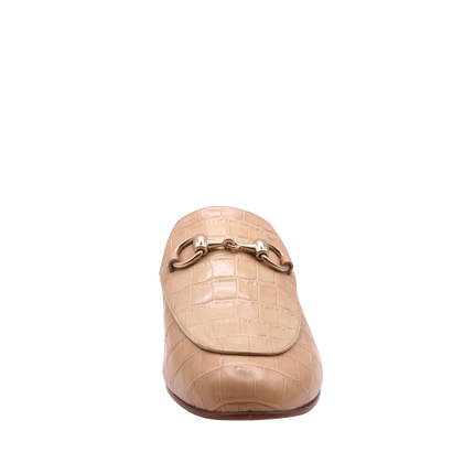 Taupe crocodile-embossed leather mule with a pointed toe, low heel, and a gold buckle detail on the top. front view 