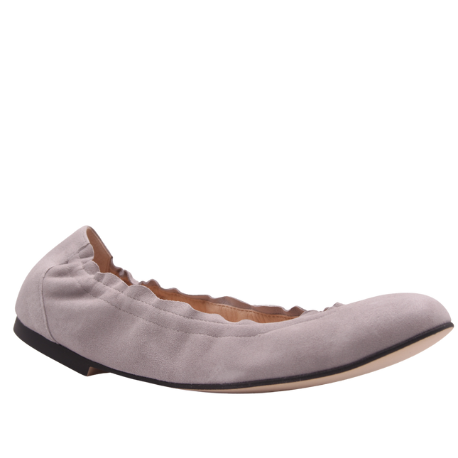 light pink suede ballet flat with a rounded toe and elasticated topline. angle view