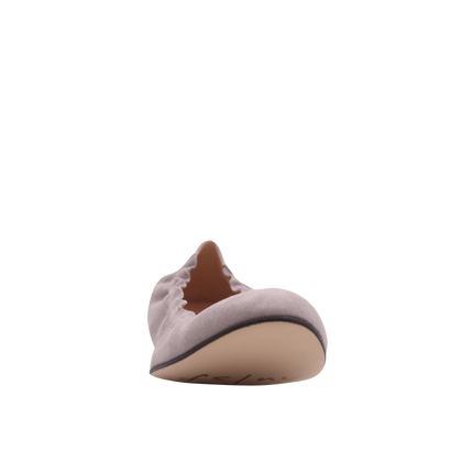 light pink suede ballet flat with a rounded toe and elasticated topline. front view