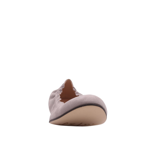light pink suede ballet flat with a rounded toe and elasticated topline. front view
