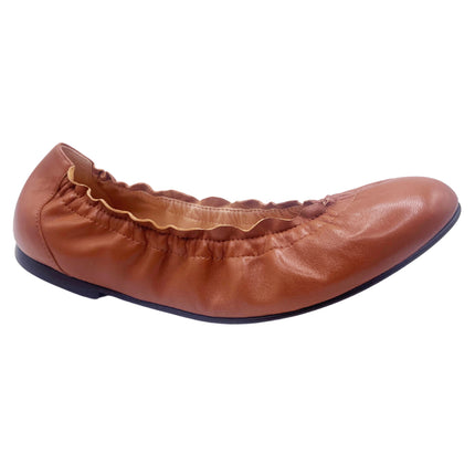 cognac leather ballet flat with a rounded toe and elasticated topline. angle view