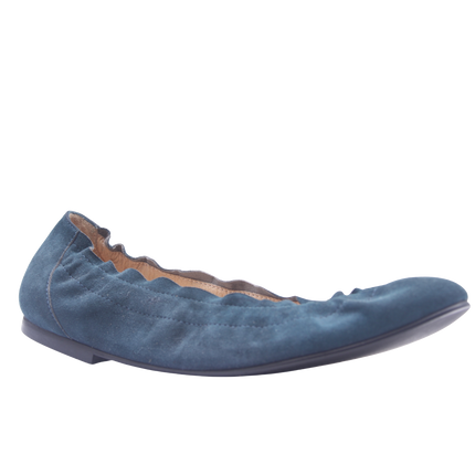 blue suede ballet flat with a rounded toe and elasticated topline angle view 