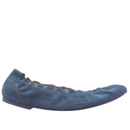 blue suede ballet flat with a rounded toe and elasticated topline side view 