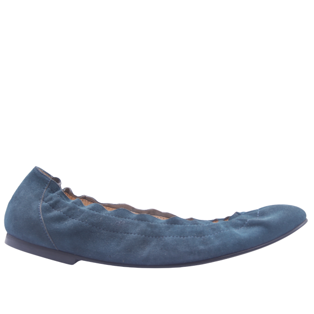 blue suede ballet flat with a rounded toe and elasticated topline side view 