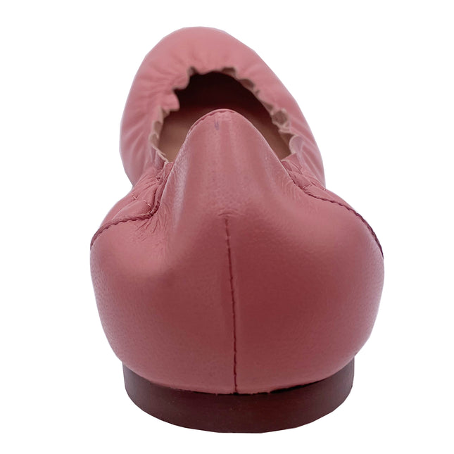 A salmon leather ballet flat with a scalloped edge and comfortable rubber sole. back view 