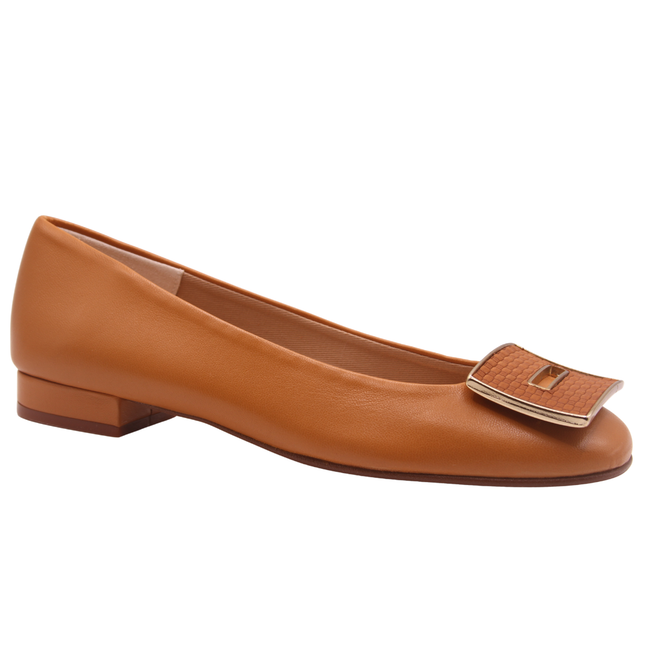 Cognac leather flat with a square toe, a small heel for slight lift, and a textured cognac buckle with gold detailing on the toe box angle view 