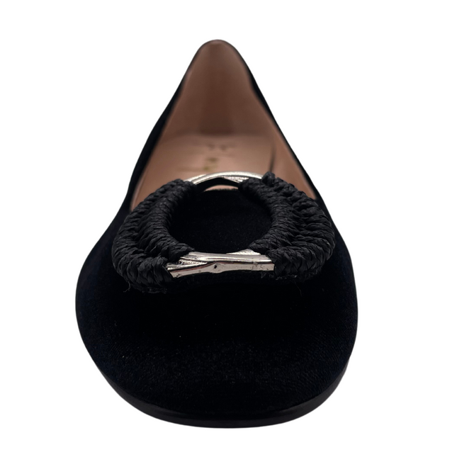 Black velvet pump with a rounded toe, block heel, and a silver buckle wrapped in black detailing on the toe box front view 