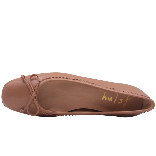 cappuccino leather ballet flat with a rounded toe, leather trim on top line, and a small bow on the front. top view 