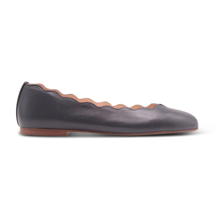 Navy leather ballet flat with a rounded toe and scalloped edge along the topline SIDE VIEW 