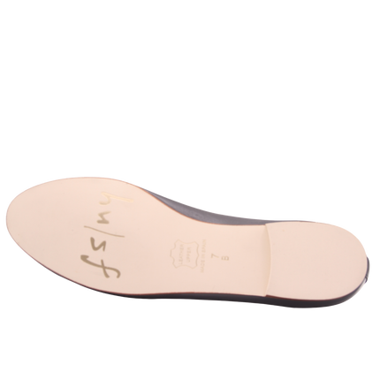 Sole view of jigsaw navy leather flat. 