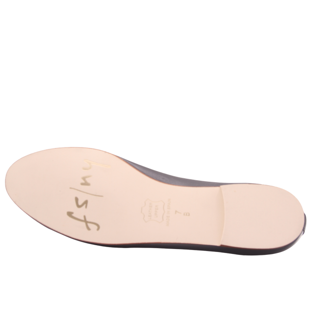 Sole view of jigsaw navy leather flat. 