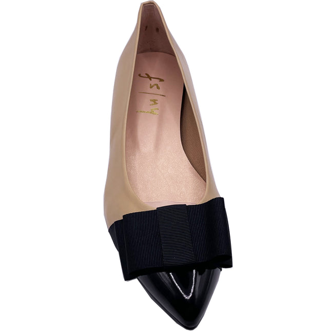 beige leather ballet flat with a pointed patent toe and a layered ribbon bow on the front front view 