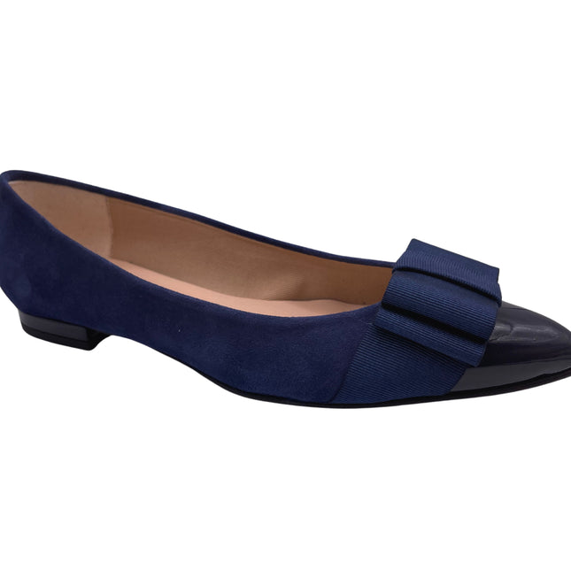 navy suede ballet flat with a pointed patent toe and a layered ribbon bow on the front. angle view 