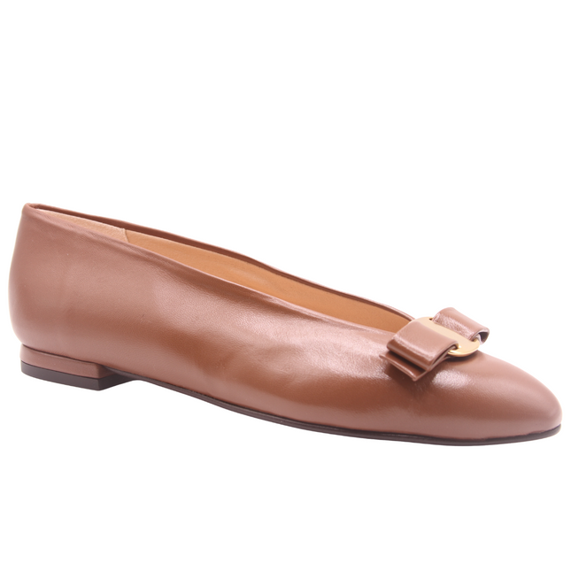 Chocolate brown leather flat shown from an angle, featuring a almond toe and a gold buckle detail with flatten bow across the front