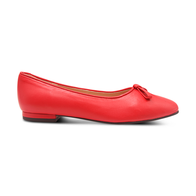 red leather ballet flat with a soft square toe, an elongated toe box, and a small red leather flatten bow detail on the front. Side View 