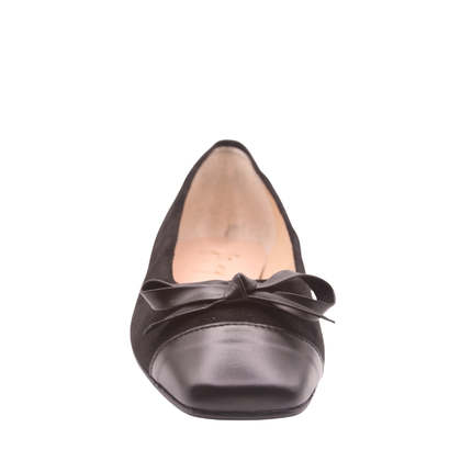 black suede ballet flat with a low heel, leather cap toe, and a small matching leather bow on the front square tow front view