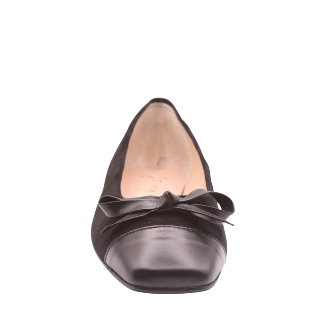 black suede ballet flat with a low heel, leather cap toe, and a small matching leather bow on the front square tow front view