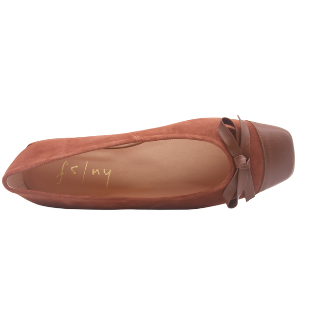 Brown suede ballet flat with a low heel, leather cap toe, and a small matching leather bow on the front square tow top view