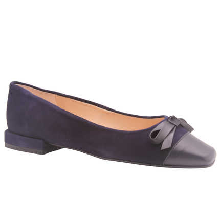 Navy suede ballet flat with a low heel, leather cap toe, and a small matching leather bow on the front square tow Angle view 