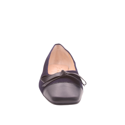Navy suede ballet flat with a low heel, leather cap toe, and a small matching leather bow on the front square tow Side view front view 