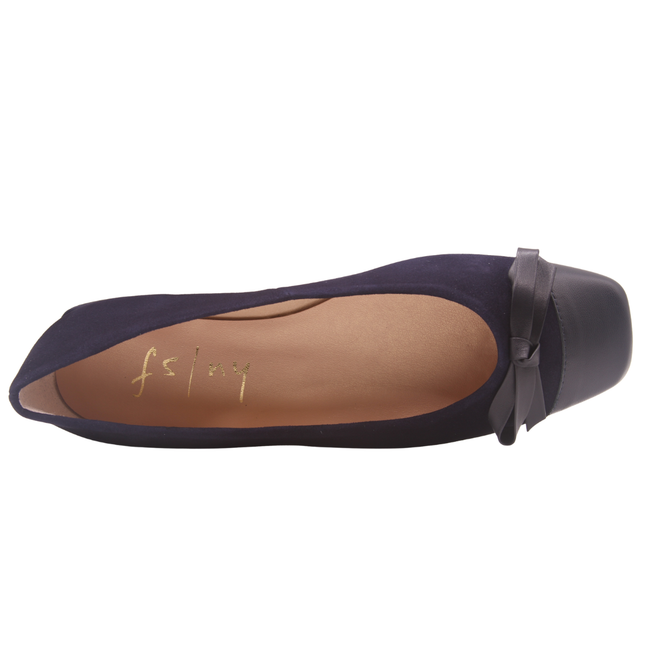 Navy suede ballet flat with a low heel, leather cap toe, and a small matching leather bow on the front square tow top view
