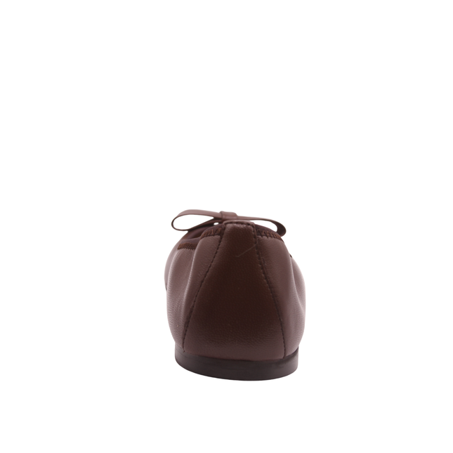 chocolate brown leather ballet flat with a rounded toe and a large folded bow accent on the front. Back View 