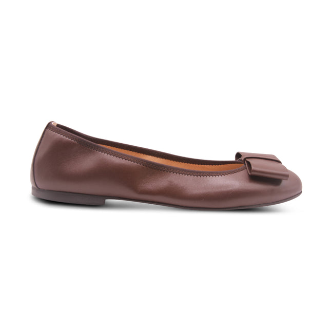 chocolate brown leather ballet flat with a rounded toe and a large folded bow accent on the front. Side view