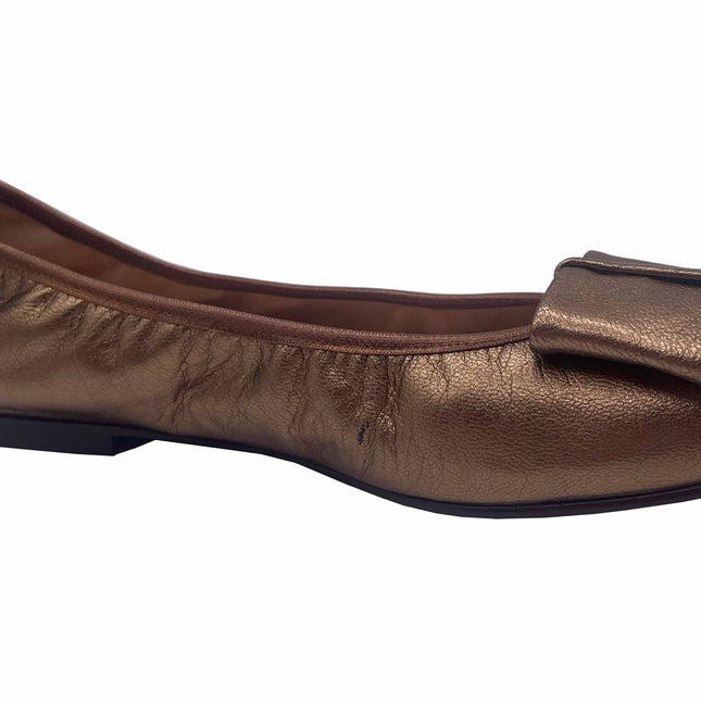 Bronze Metallic leather ballet flat with a rounded toe and a large folded bow accent on the front. side view Angle View