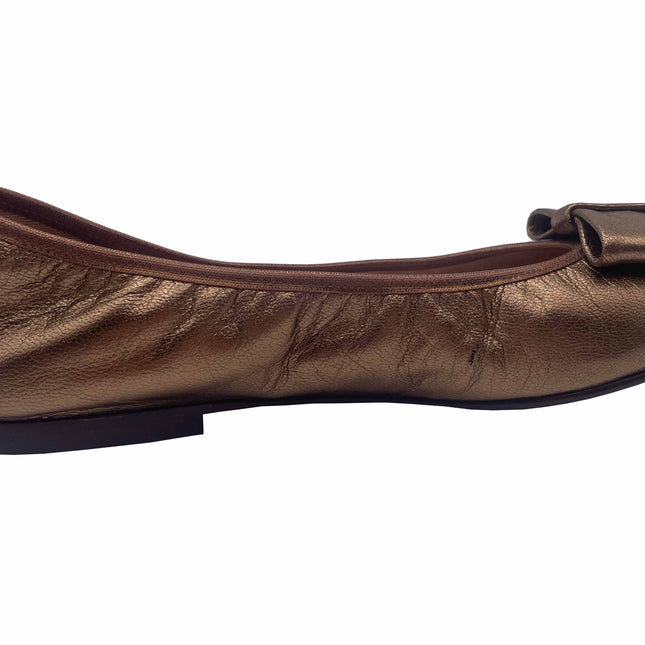 Bronze Metallic leather ballet flat with a rounded toe and a large folded bow accent on the front. side view