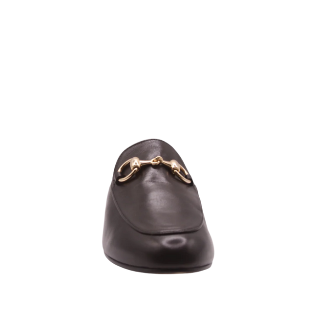Black leather mule with almond toe, low heel, and a gold buckle detail on the upper front view 