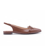 Brown leather slingback flat with a pointed toe, slim strap at the heel, and a small bow detail on the toe box. side view 