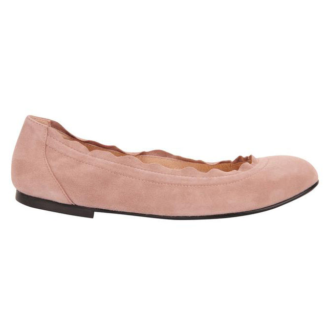 light pink suede ballet flat with a rounded toe and elasticated topline. side view