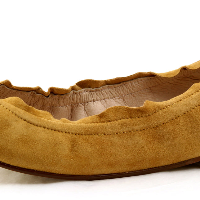 honey suede ballet flat with a rounded toe and elasticated topline. angle view 