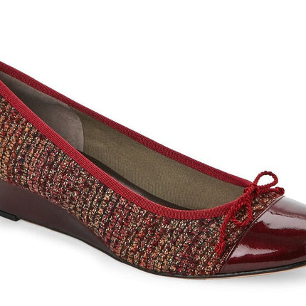 Cranberry wedge shoe with a textured tweed-style upper, glossy patent cap toe, and a small bow on the front. Angle view