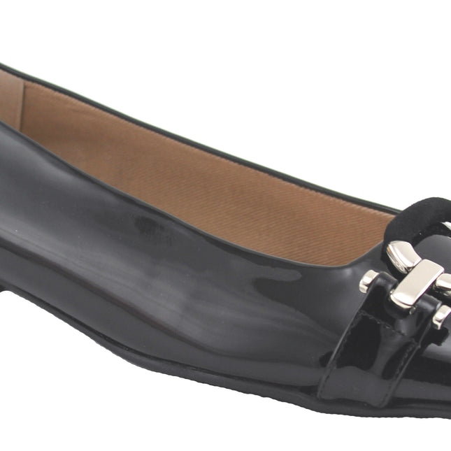 Black patent flat with a square toe, a small heel for slight lift, and a textured black buckle with silver detailing on the toe box angle view 