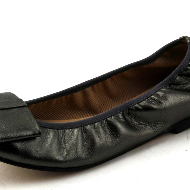 Pewter Metallic leather ballet flat with a rounded toe and a large folded bow accent on the front. Angle View 