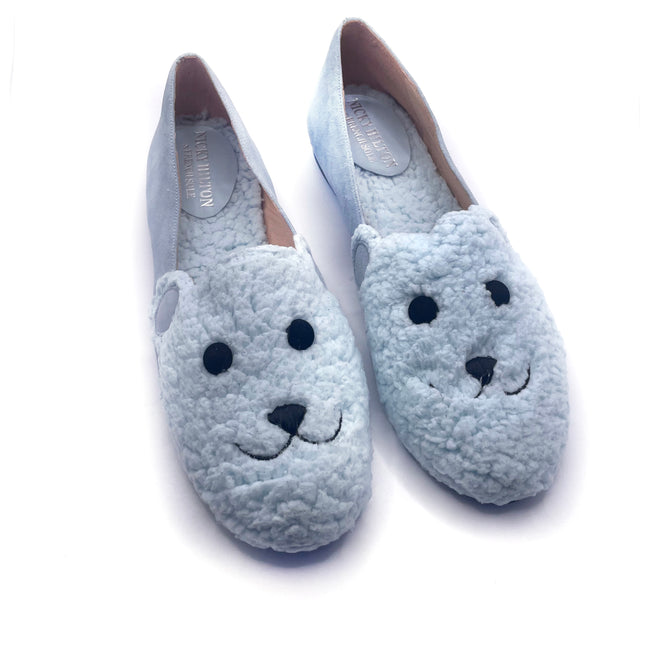 blue suede loafer with a textured teddy-fleece upper featuring stitched teddy bear face outline top of both shoes