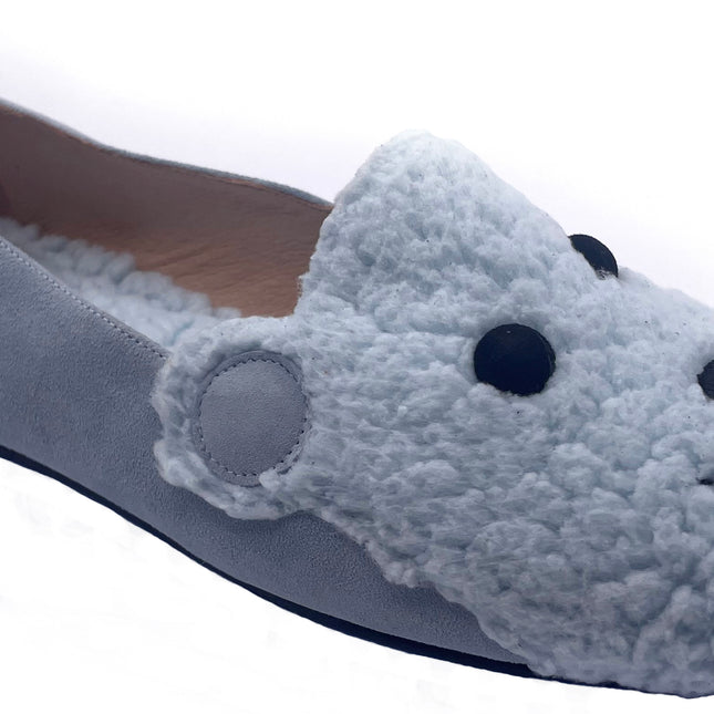 blue suede loafer with a textured teddy-fleece upper featuring stitched teddy bear face outline angle view