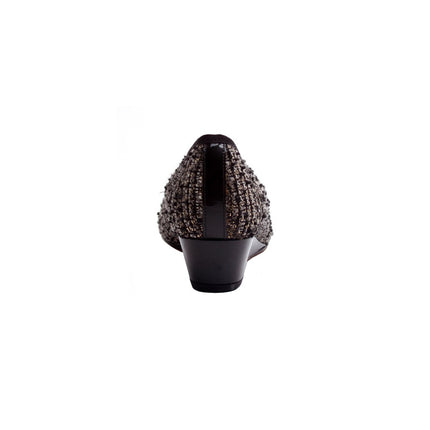 Black wedge shoe with a textured tweed-style upper, glossy patent cap toe, and a small bow on the front. back view