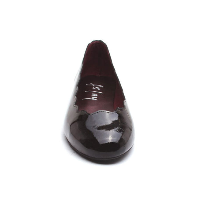 Front view of jigsaw black patent leather flat. 