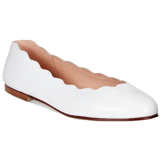 Angle view of jigsaw white leather flat. 